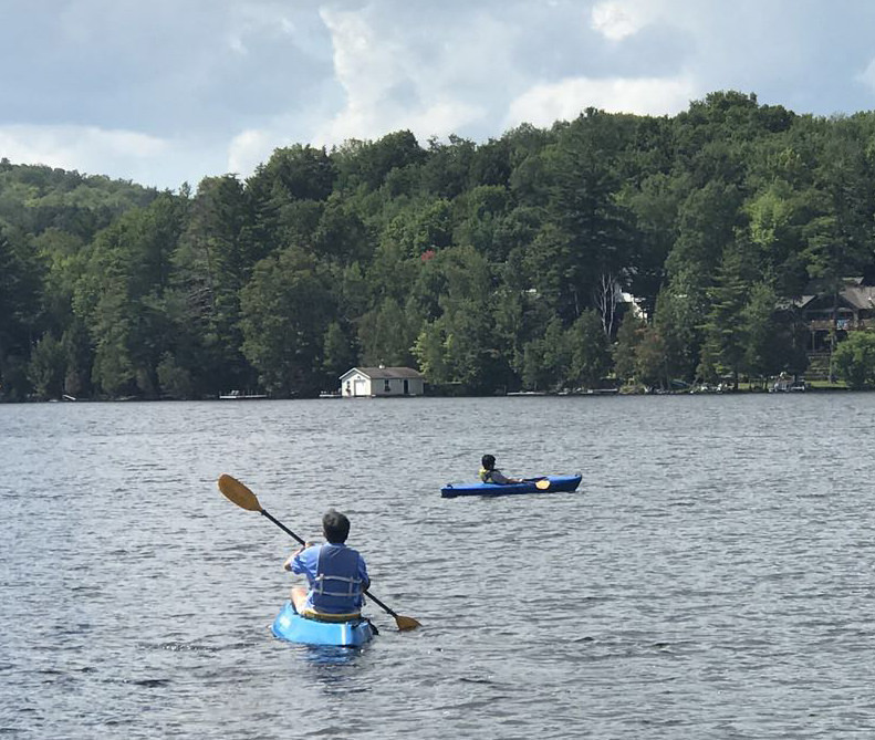 Wang relaxing with his younger son in upstate New York.