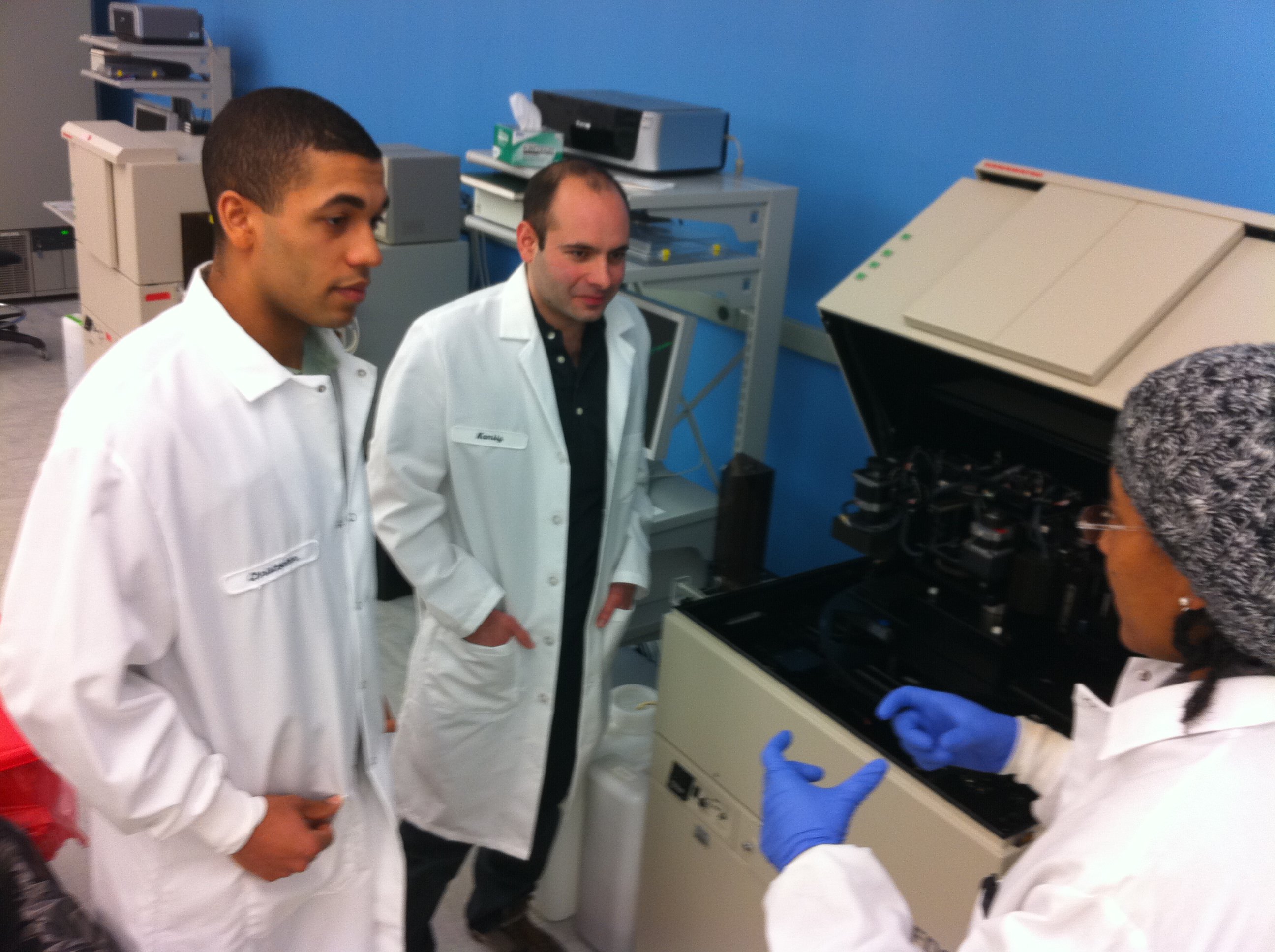 Shekdar and colleagues Zachary Greaney and Shontelle Powell in the lab.